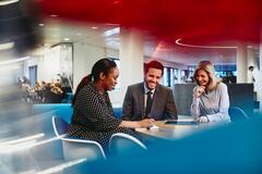 people working in an office boardroom
